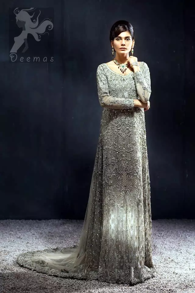 Light fawn full-length back trail maxi for Walima / Reception brides. Maxi features stunning embellishments all over the front. Embellished border implemented on the back hemline. This dress comes with a matching dupatta.