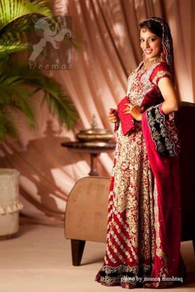 This bridal stands out due to its uniqueness and the perfect fusion of modern cut and traditional embroidery. Deep red pure chiffon front open gown features stunning embellishment all over the front. This super stunning shirt is made of rich floral embroidery which is further enhanced with zardoze work. Hemline is decorated with embroidered black applique and banarsi patch at the end. Matching deep red dupatta. Dupatta contains embroidered border on four side edge and lighter work on the ground.