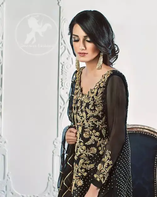 The Black semi-formal shirt features beautiful lovely embellishments on the neckline. Sequins spray scattered all over the front and back.