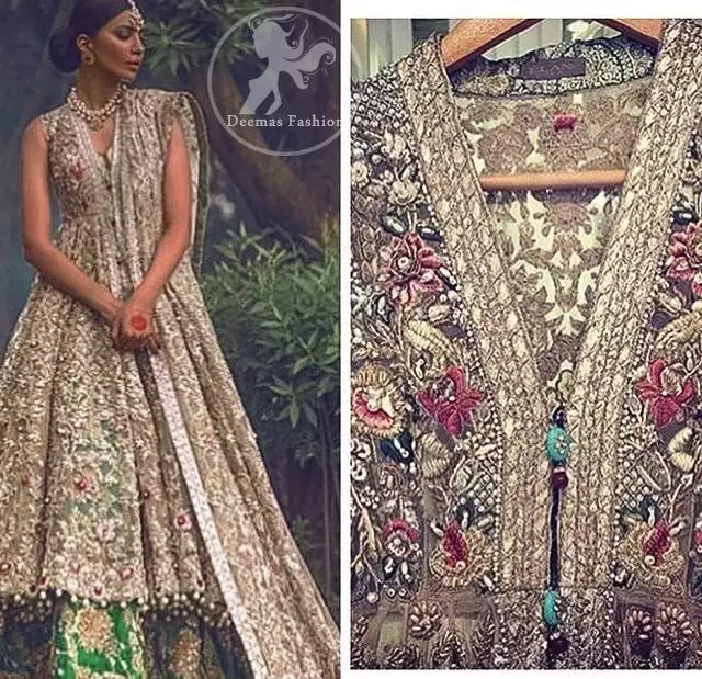 The frock has been adorned with beautiful flourishing embroidery all over the front and back. A work border has been implemented on the hemline Sleeveless. Dangling beaded balls crafted on the hemline. Lehenga contains large embroidered motifs all over. Work includes Kora, dabka, stones, sequins, beads, multiple colour Resham, and Swarovski crystals.