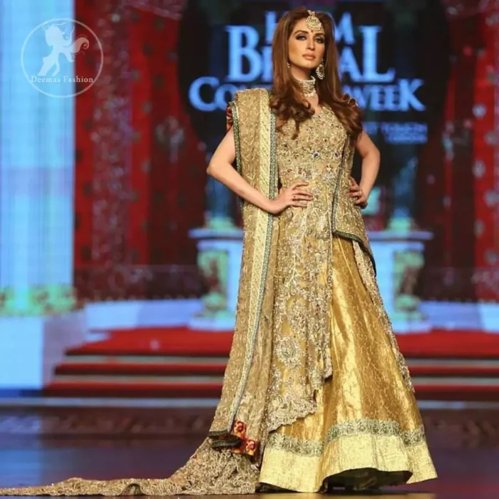 Golden organza lehengha comes with pure crinkle chiffon dupatta having heavy embroidery. Dress comes with front open long back trail gown.  
