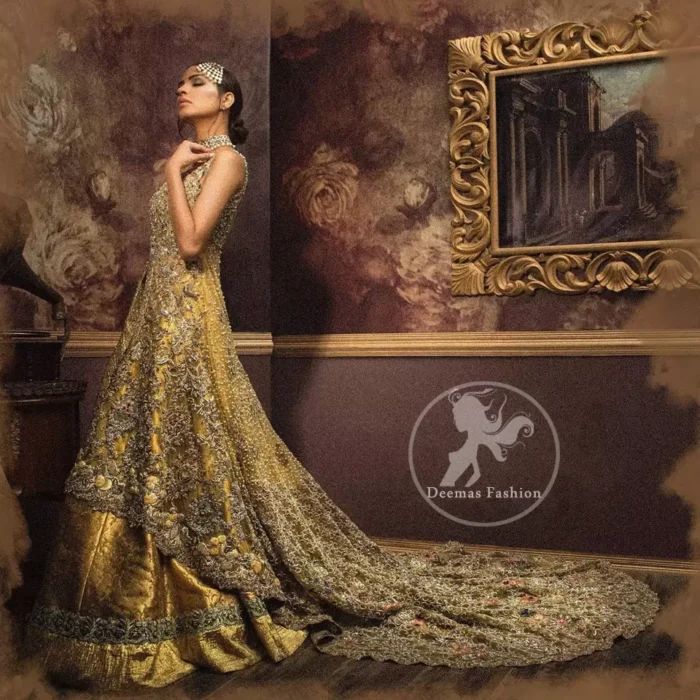 Golden organza lehenga comes with a pure crinkle chiffon dupatta having heavy embroidery. The dress comes with a front-open long-back trail gown.