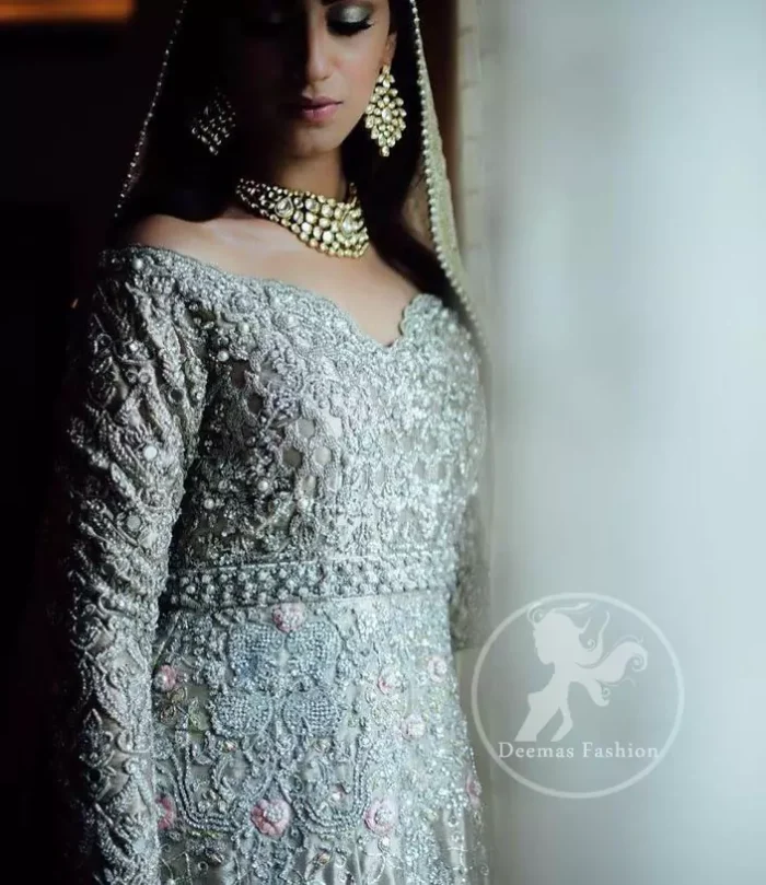 The frock has been adorned with a fully embroidered bodice. The frock features beautiful and fabulous embellishment front and back. The dress contains a working border on the hemline. Compliment with embellished waist belt. Dupatta has a four-sided embroidered border.