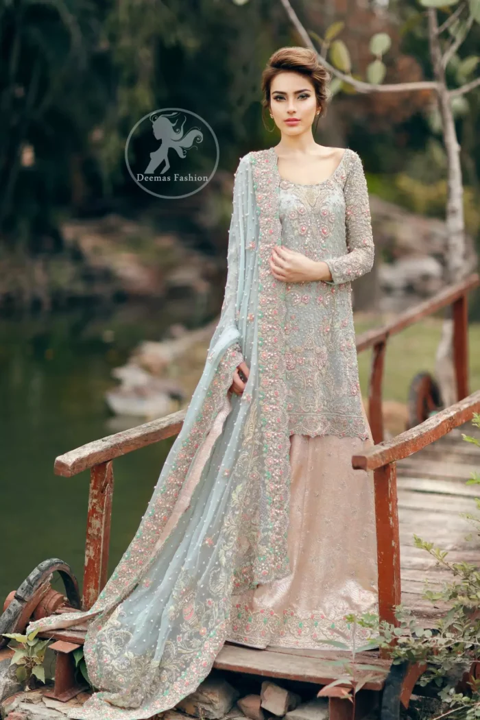 Light Blue Embroidered Shirt. The shirt has been adorned with embellishments accent all-over the front. Full sleeves have been embellished with the same embroidery all over them.
