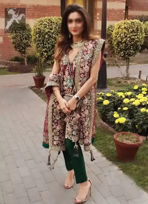 Claret colour peplum having halter neck design with bottle green loose trousers and heavy embellished Dupatta