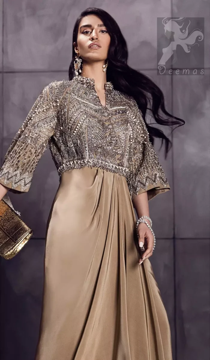 Fawn brown silky maxi has embellished bodice and sleeves. Bodice and sleeves have been embellished with dark gray embellishment and ivory pearls.