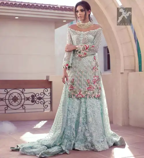 Sweetheart neckline pure crinkle chiffon shirt adorned with embellishment. Embellishment includes majorly light golden, silver, shocking pink and mehndi green