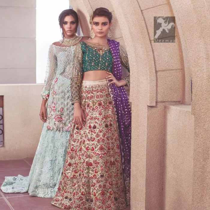 Sweetheart neckline pure crinkle chiffon shirt adorned with embellishment. Embellishment includes majorly light golden, silver, shocking pink and mehndi green shades. Shirt comes with embroidered sharara and net dupatta.