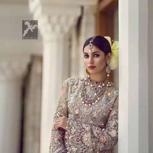 Ivory white long fitted bridal maxi. Maxi adorned with colorful embellishment using appliques and threads. Bridal maxi comes with two