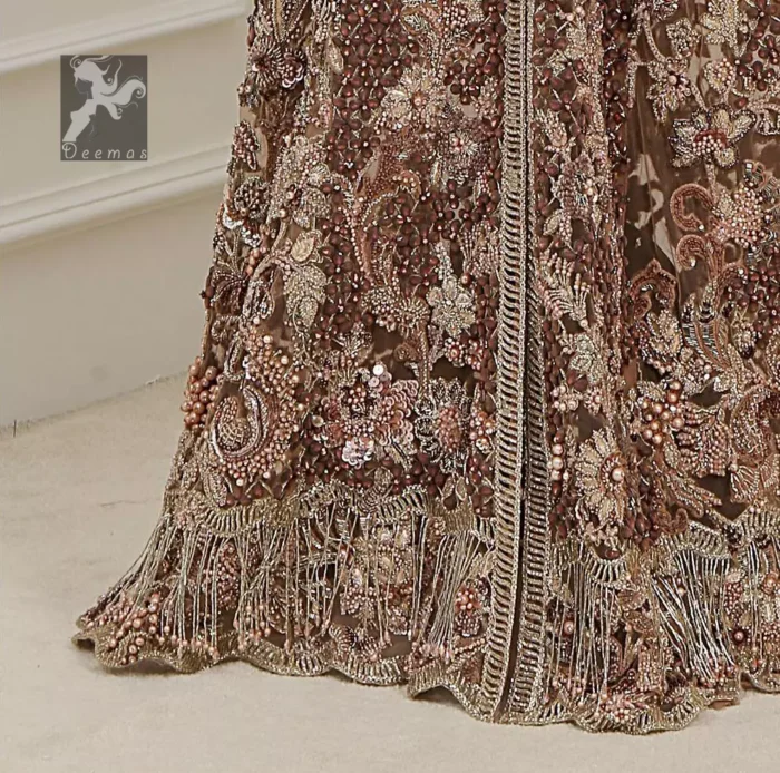 Light brown front open net maxi having brandy rose bodice. Maxi adorned with brown, light golden, champagne and silver embellishment. Pure organza dupatta adorned with embellished border.