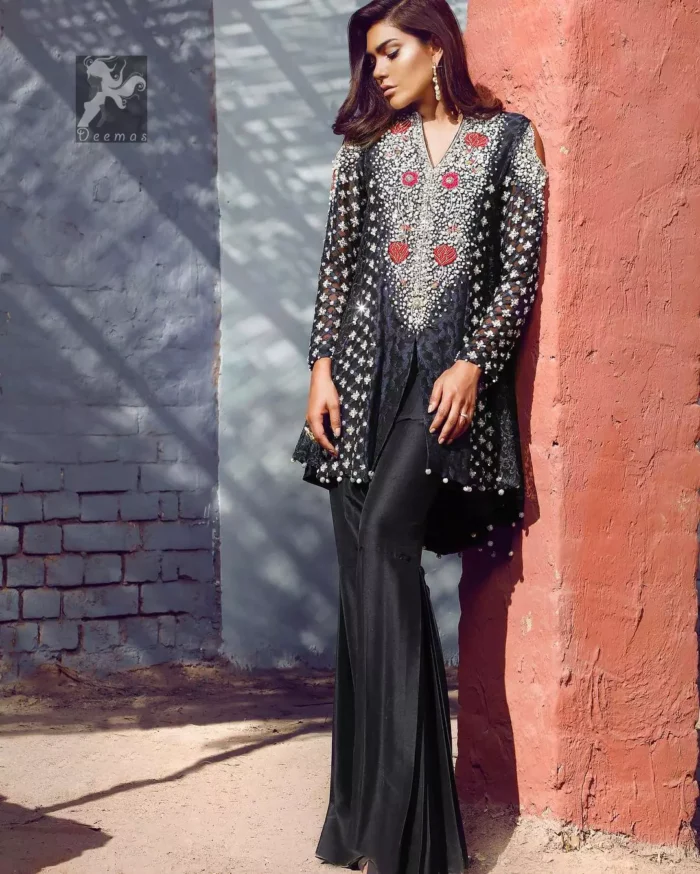 Black peplum made with pure banarsi jamawar chiffon. Peplum having multiple panels of different banarsi patterns. White and silver embellishment on neckline, side panels and sleeves. Pure raw silk sharara pants.