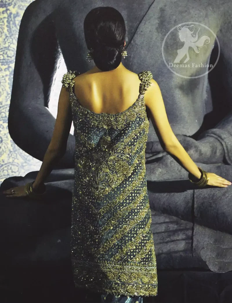 Bluish Slate Gray velvet shirt has been adorned with antique shades of embellishment.Embellished 3d motifs has been applied on shoulders. Brocade lehengha / skirt having embellished border on the hemline.