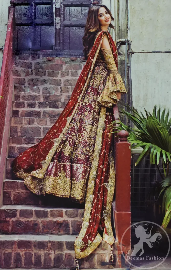 Alpine Blouse is of pure tissue. Top has cold shoulders design also having umbrella shaped sleeves. Blouse has been embellished with antique shades of embellishment. Wineberry heavy embellished lehengha featuring swarovski, crystals, pearls and golden shaded kora, dabka and naqshi. It has been adorned with beautiful different shaded embellishment also having large appliqued border on hemline. It is artistically coordinated with maroon dupatta which  is fully decorated with appliqued border on edges and wavy sequins pattern all over it.