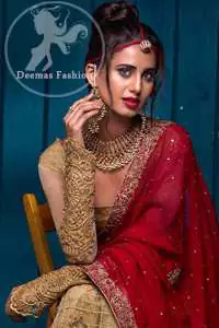 This outfit has an antique brass pure banarsi jamawar blouse and embroidered net full sleeves. It comes with a lehenga that embodies a criss-cross pattern all over it. It is further enhanced with floral borders around daman. Lehengha is scalloped and highlighted with tilla and silk thread embroidery (Resham). It is embellished with dull golden, antique-shaded kora, dabka, tilla, and sequins. This outfit is beautifully coordinated with a scarlet embellished dupatta, decorated with four-sided floral embroidery and spray of different sizes of floral motifs and sequins all over it.