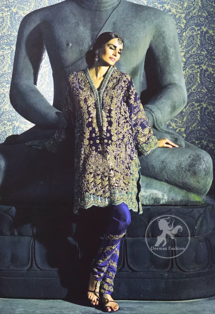 This classic shirt is reflecting exuberant colours. Kurta style shirt meticulously highlighted with antique kora, dabka, pearls and sequins. It has silhouettes adorned with neckline. This shirt is decorated with front and back panels having gorgeous floral embroidery. Shirt is fully scalloped, artfully coordinated with delicate embroidered pajama. It comes with chiffon dupatta decorated with sequins spray all over.
