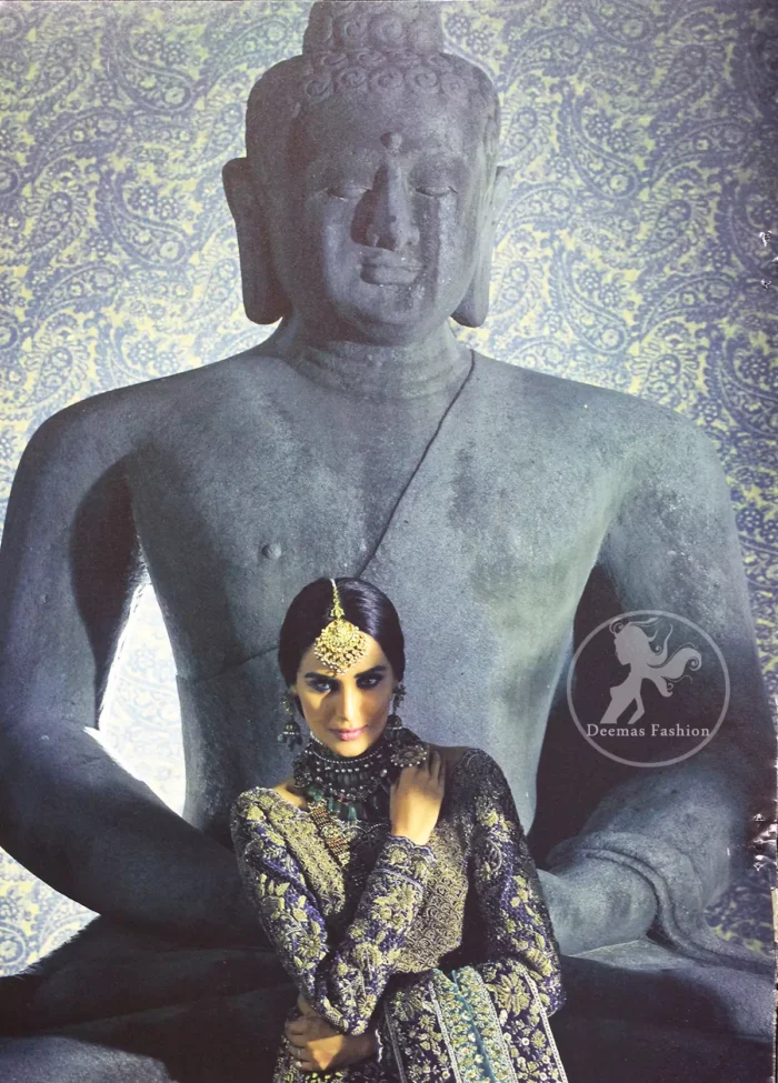 Violet Blue Blouse is of velvet fabric. It is heavy embellished full sleeves blouse featuring antique and golden shaded kora, dabka, resham, naqshi, pearls, crystals and swarovski. Blouse is fully scalloped with blue bayoux resham outline. Sleeves are adorned with floral work and sprinkling sequins/naqshi on it, while bodice having criss cross pattern all over it. It comes with raw silk lehengha which is adorned with block printing and the touch of hand embellishment. It is artistically coordinated with blue bayoux dupatta which is adorned with fully embellished appliqued borders. Borders are accompanied by delicate work along its internal sides. There are four embellished heavy flowers on corners and small floral pattern all over it.