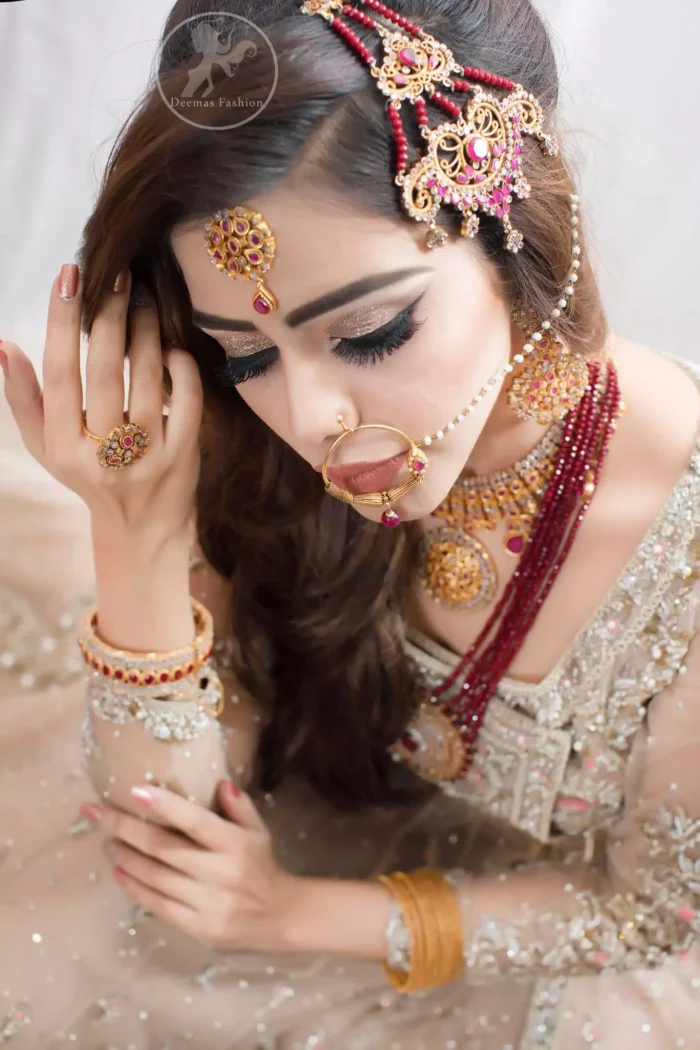 It comes with heavy embellished lehengha which has been adorned with large border on hemline. It is artistically coordinated with embellished dupatta.