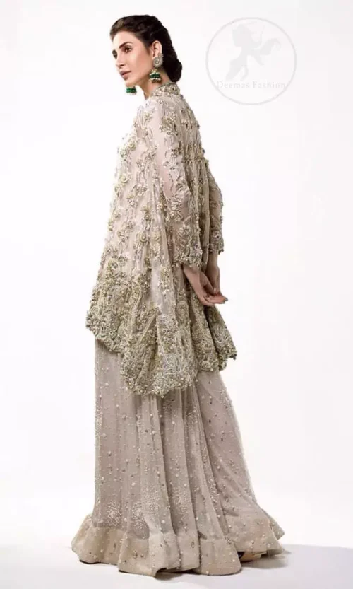 This sides-down Oyster Pink Short Frock comes with sharara which is adorned with floral motifs all over it.