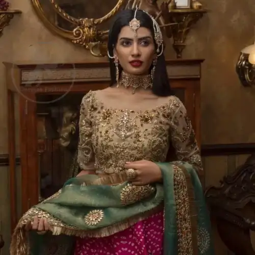 This outfit is a timeless beauty. Its blouse is heavily embellished with silver gold kora, dabka, sequins and swaronski crystals.