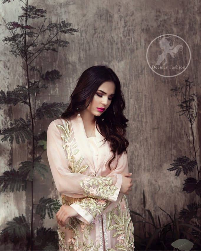 This dress is beautifully sculptured with floral embroidery. It is adorned with kora, dabka, tilla and thread embroidery. It is adorned with delicate tassels which adds to the look. It is beautifully paired up with trousers having embellished motif. It comes with chiffon dupatta, sprinkled with sequins all over.