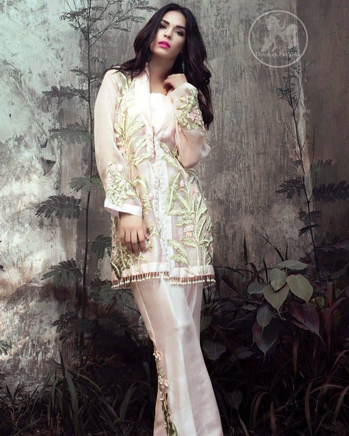 This dress is beautifully sculptured with floral embroidery. It is adorned with kora, dabka, tilla and thread embroidery. It is adorned with delicate tassels which adds to the look. It is beautifully paired up with trousers having embellished motif. It comes with chiffon dupatta, sprinkled with sequins all over.