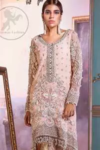 This outfit is decorated with silver kora, dabka, tilla, sequins and pearls. This dress is embellished with floral embroidery and intricate embroidered hemline. It is adorned with beautiful tassels which adds to the look. Sleeves are fully embellished. Trail is also embellished. It comes with brocade pajama. It is coordinated with chiffon dupatta which is sprinkled with sequins all over it.