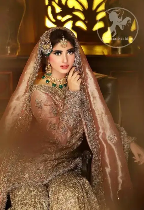 Feel glamorous in antique brass short shirt with fascinating embellishment on neckline with golden kora dabka, tilla and pearls. Floral