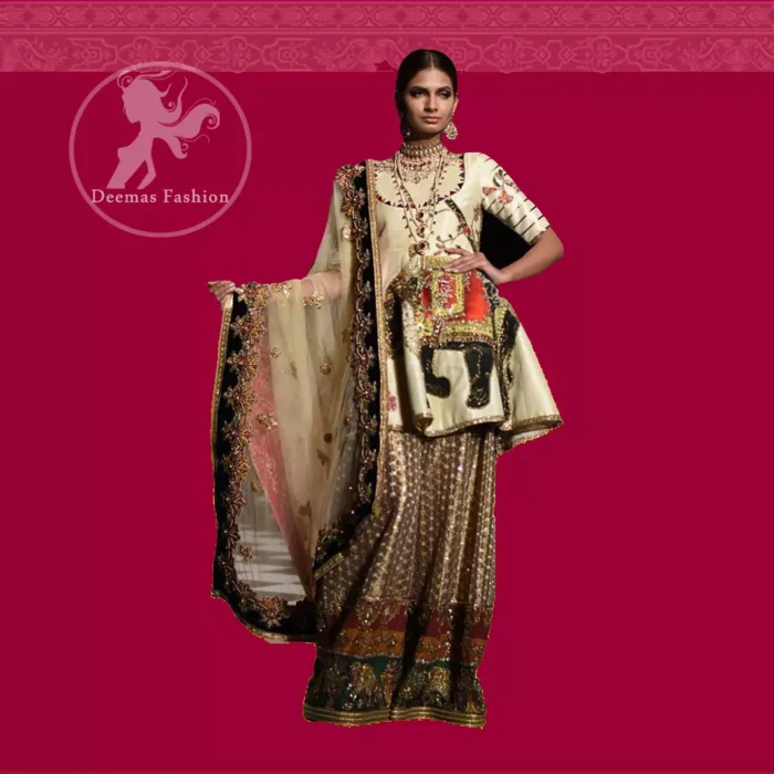 This signature angrakha is crafted with raw silk featuring hand embroidery with elegant zardoze work. The sharara with it is made of brocade with applique detail on bottom done with kora dabka, kundan and tilla work. It comes with ivory dupatta adorned with black applique and heavy embellished borders on all sides.