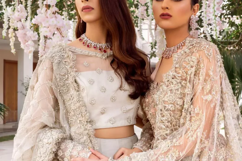 This super stunning skirt is made of rich floral embroidery which is further enhanced with kora dabka work. Blouse is meticulously embellished from neckline and sprinkled floral motifs on ground. It is paired up with ivory dupatta embellishment on sides which looks so breathtaking elaborate it with crisscross lines.