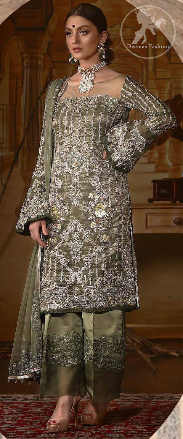The beautiful bodice is decorated with intricate stones and sequins. It is further enhanced with vertical lines and floral motifs done with kora dabka, tilla, sequins and colorful thread work. Paired up with embroidered bell bottom. This outfit is beautifully coordinated with olive green dupatta with embellished borders on sides and sprinkled sequins.