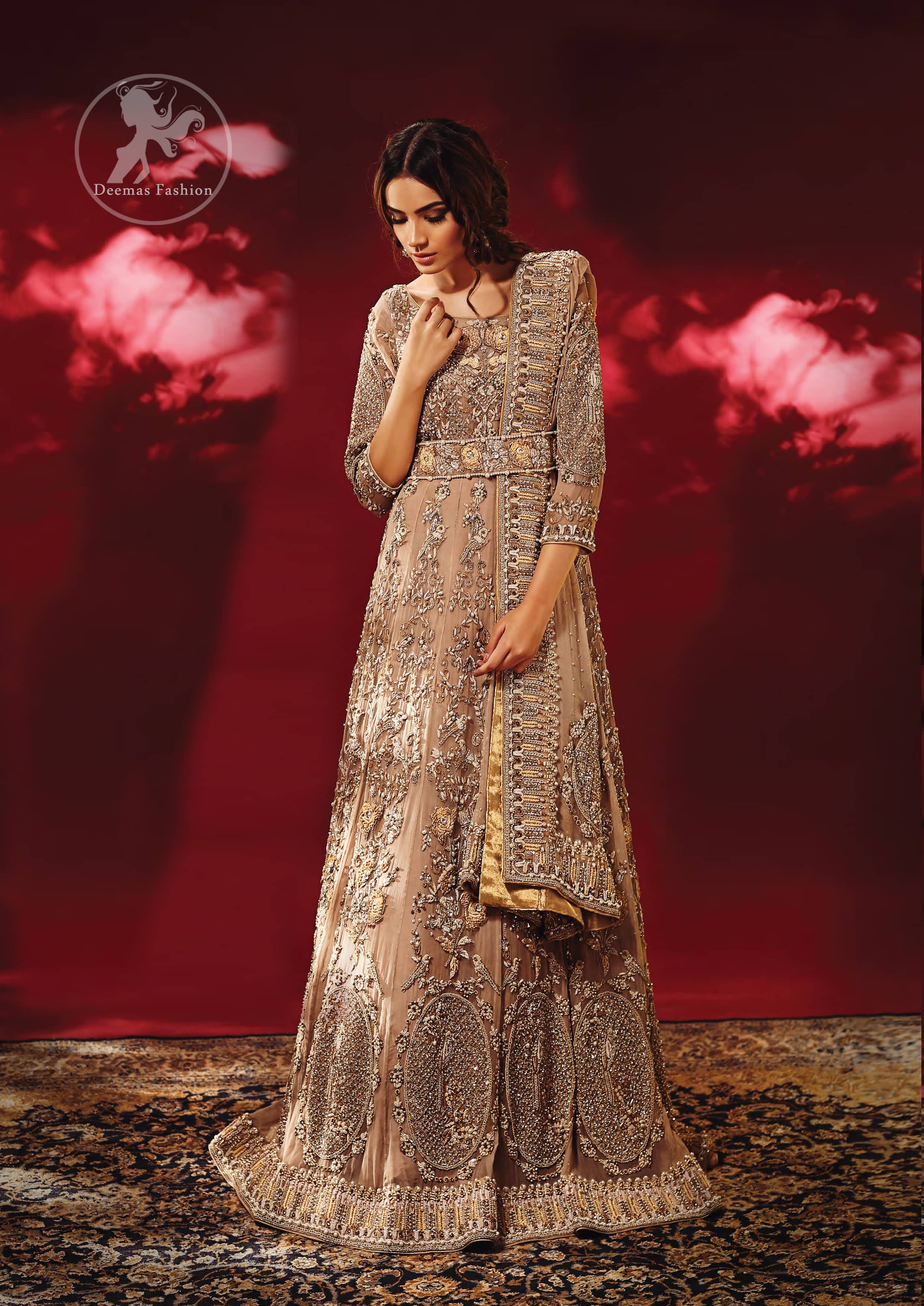 Redefine your style in this traditional and versatile ensemble ornamented with floral and geometric embroidery furnished with antique shaded kora dabka kundan and pearls. It comes with brocade cigarette pants. It is stunningly coordinated with antique brass dupatta with embellished borders on all sides and sequins spray all over.