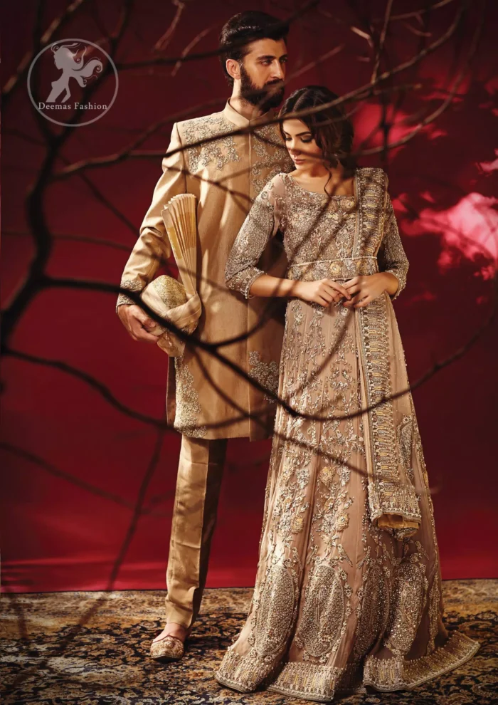 Redefine your style in this traditional and versatile ensemble ornamented with floral and geometric embroidery furnished with antique shaded kora dabka kundan and pearls. It comes with brocade cigarette pants. It is stunningly coordinated with antique brass dupatta with embellished borders on all sides and sequins spray all over.