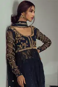 The border on the daman is enhanced with thread embellished floral pattern detailing that instantly draws attention. It comes with matching cigarette pants.