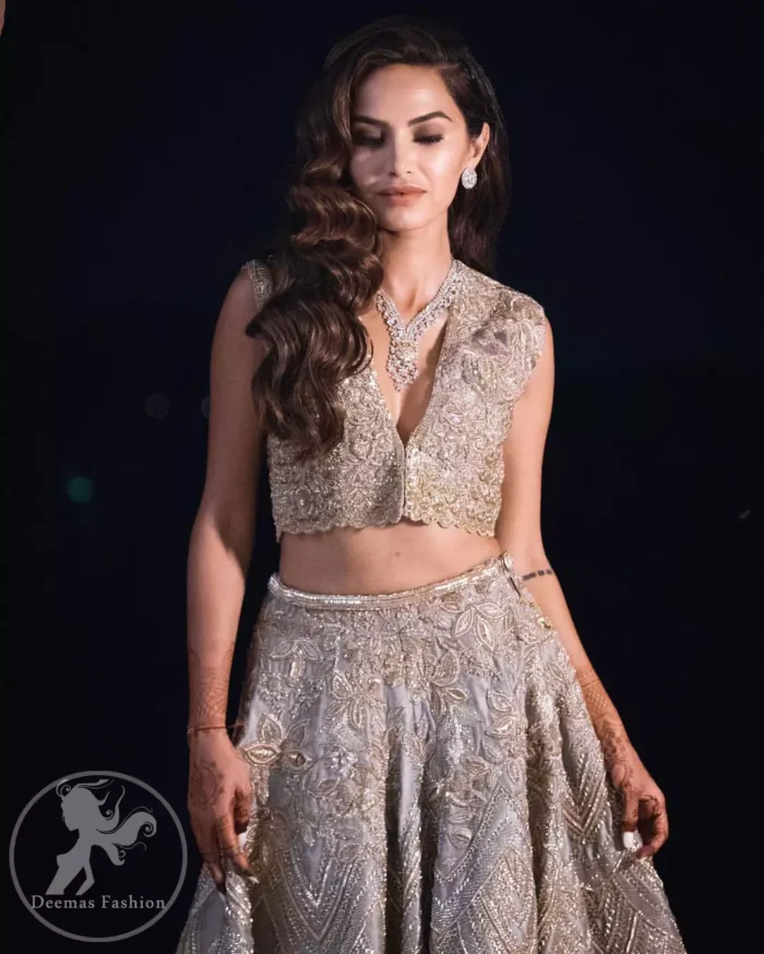 This bridal dress is perfect for your special day. Beautifully decorated with floral embroidery and embellished scalloped border. It is adorned with kora, dabka, tilla, sequins and pearls. It comes with an exquisite lehengha with thick embroidered border to give it a regal look. Dupatta comprises of floral thread embroidery allured with thick embellished border.