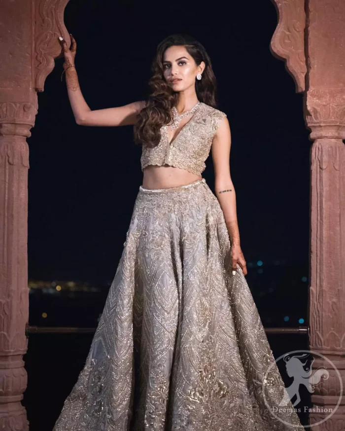 This bridal dress is perfect for your special day. Beautifully decorated with floral embroidery and embellished scalloped border. It is adorned with kora, dabka, tilla, sequins and pearls. It comes with an exquisite lehengha with thick embroidered border to give it a regal look. Dupatta comprises of floral thread embroidery allured with thick embellished border.