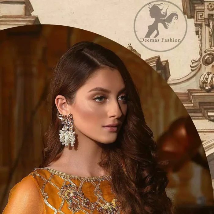 This exquisite shirt is fully decorated with floral and different motifs patterns all over it. This dress is beautifully decorated with heavy embroidery. It is highlighted with kora, dabka, tilla, sequins and pearls. Lehengha is fully embellished with tilla work. It is artistically coordinated with net dupatta which is embellished.