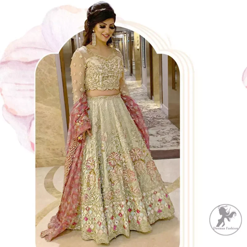 This dress is adorned with floral embroidery, highlighted with kora, dabka, tilla, sequins and pearls. It is allured with intricate embroidered motifs and detailed bodice. Blouse is scalloped. The border on hemline is enhanced with embellished floral pattern detailing, that instantly draws attention.It comes with embellished net lehengha with brocade lining. It is artistically coordinated with net dupatta which is allured with four sided border.