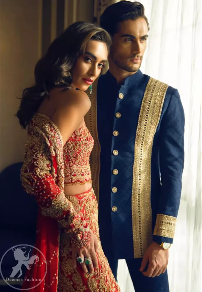 This bridal blouse executing heavily handcrafted art of zardozi. This dress is beautifully decorated with heavy embroidery. It is highlighted with kora, dabka, tilla, sequins and pearls. It comes with an exquisite back trail lehengha with thick embroidered borders to give it a regal look. It is coordinated with chiffon dupatta which is allured with zikzak pattern and four sided embellished scalloped borders.