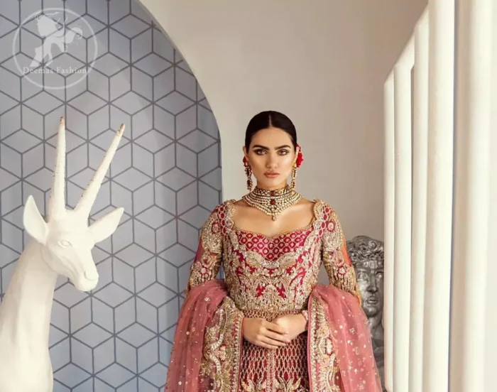 This bridal dress is perfect for your special day. Beautifully decorated with floral embroidery and embellished scalloped border. It is adorned with kora, dabka, tilla, sequins and pearls. It comes with an exquisite lehengha with thick embroidered border to give it a regal look. Dupatta comprises of floral thread embroidery allured with thick embellished border.
