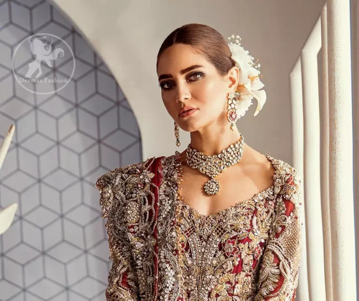 Look alluring in this floor length frock embellished with kora dabka, tilla, swarovsky and pearls. It has intricate embroidered motifs and detailed bodice. The border on the daman is enhanced with embellished floral pattern detailing that instantly draws attention. Heavy back trail frock adds to the look. It comes with matching pajama. It is paired up with heavy embroidered dupatta.