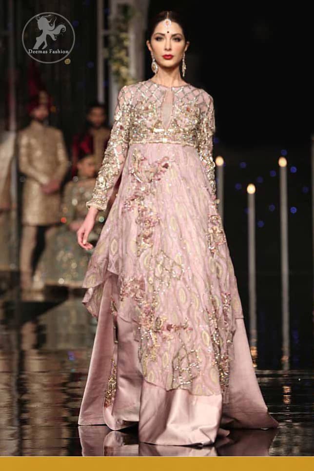 The fusion of unique crafting and a soothing palette lends exquisite elegance and minimalistic sobriety to your opulent evening wear done with light gold kora dabka, kundan and sequins work. It is further enhanced with tilla and sequined geometric embroidery all over. Having full length sleeves and handcrafted belt and fully embellished from back.