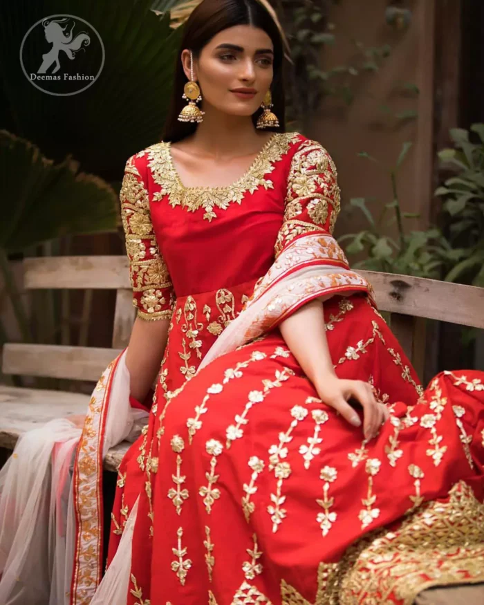 Exude elegance and class in this anarkali frock finessed with beautiful hand crafted embellishment. Embellished neckline and three quarter sleeves enhanced the look. It is further enhanced with verticle styled lines done with golden gotta work. It comprises with detail on bottom. Paired up with churidar pajama and ivory dupatta which is having embroidered border on sides.