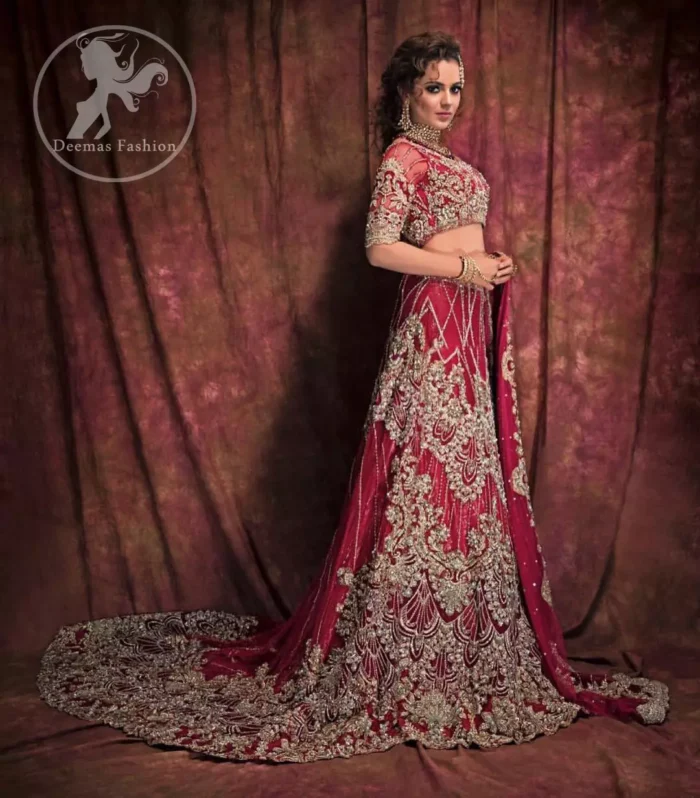 This dress is beautifully decorated with heavy embroidery. It is highlighted with dull golden kora, dabka, tilla, sequins and pearls. Fish lehengha is fully embellished.Blouse is scalloped. It comes with beautifull upper gown, sprinkled with sequins all over it. It is coordinated with chiffon dupatta which is sprinkled with sequins all over it.