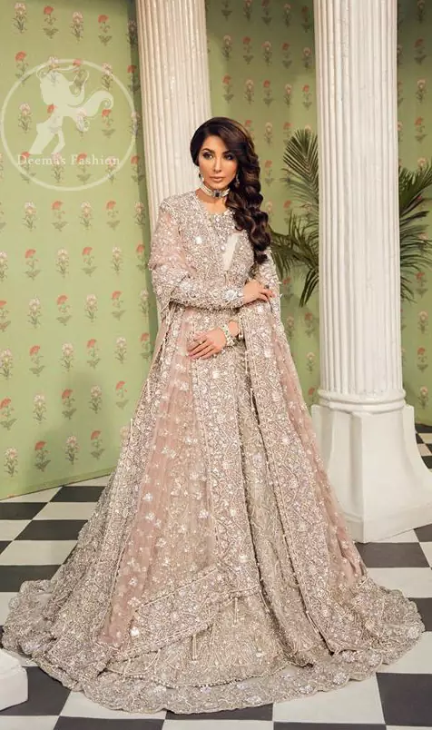 This outfit is a timeless beauty. Exude elegance and class in this full embroidered chiffon frock with zardosi work details and rich hemline. It is adorned with heavily embellished neckline and fixed waist belt. It comes with beautifull lehenga enhanced with thick embellished bottom to gives it a regel look.  This outfit is coordinated with net dupatta sprinkled with floral motifs all over it. The dupatta incorporates beautifully designed borders on all four sides, focusing on the heavily embellished pallu borders to give it a perfect look.