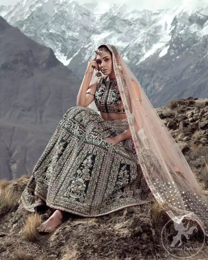 Delicately crafted and personifying chic elegance with an element of grandiose. This dress is beautifully sculptured with floral embroidery, adorned with silver kora, dabka, pearl and sequins work all over. Blouse is beautifully decorated with multiple color floral embroidery . It comes with bottle green lehenga adorned with different styles motifs, geometric patterns and floral embroidery. This outfit is coordinated with chiffon dupatta which is sprinkled with sequins all over it. The borders of dupatta enhanced with lace.