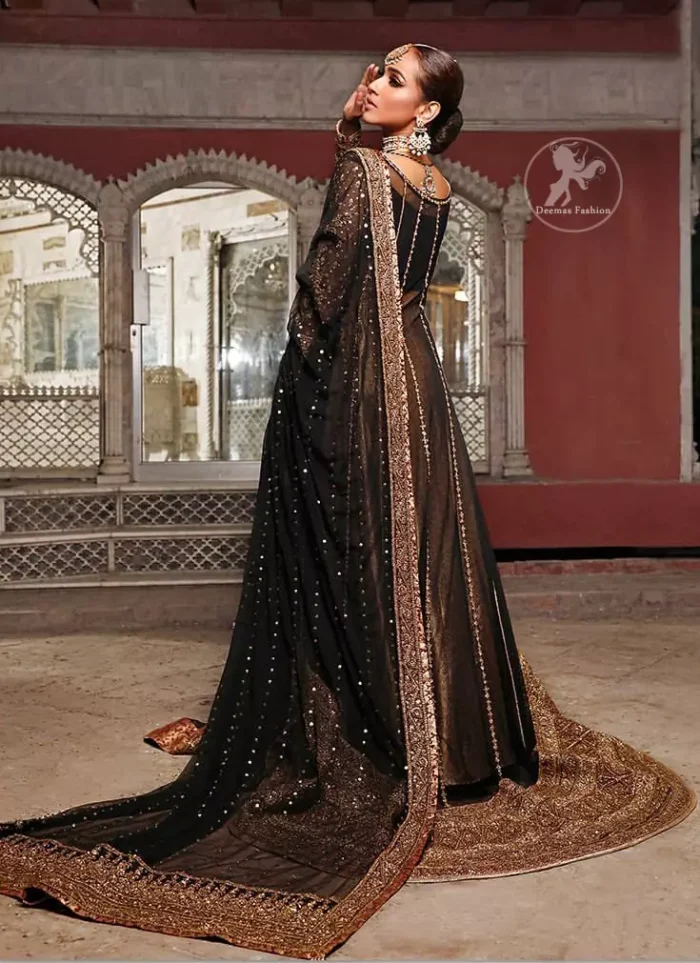 Epitomize whimsical elegance in this front open gown adorned with applique borders and multiple panels. It is further enhanced with kora, dabka, tilla, sequins and pearls. It is allured with atlas brocade inner which adds to the look. It comes with brocade pajama. It is coordinated with chiffon dupatta having four sided embellished applique.