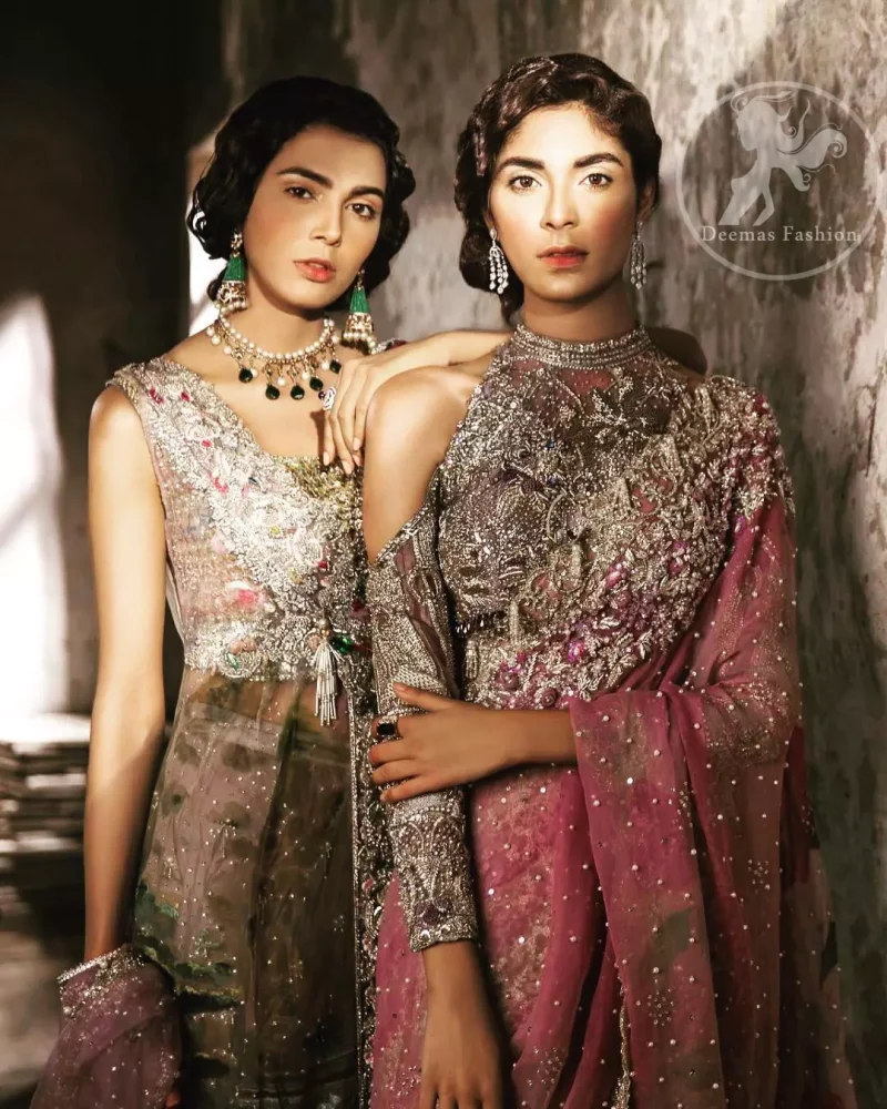 This dress is beautifully sculptured with floral embroidery. It comes with fully embroidered brocade blouse having halter neckline which adds to the look. Pallu is highlighted with kora, dabka, tilla, sequins and pearls. It is allured with scalloped embroidered border. Lehengha is fully embellished.