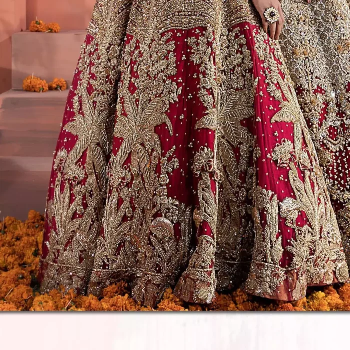 Captured in traditional silhouette, The bridal stands out due to its uniqueness and the perfect fusion of modern cut and traditional embroidery. This dress is beautifully decorated with heavy embroidery. It is highlighted with kora, dabka, tilla, sequins and pearls. Blouse is enhanced with zardosi work on neckline. It comes with full embellished lehenga adorned with applique, floral motifs and sequins spray all over it. It is coordinated with tissue dupatta which is sprinkled with sequins all over it. It is further furnished with four sided scalloped border.