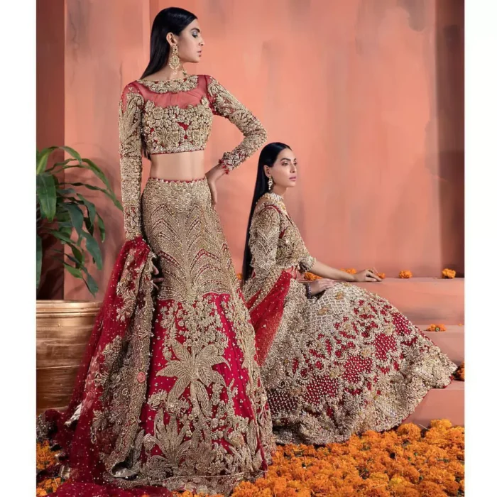 Captured in traditional silhouette, The bridal stands out due to its uniqueness and the perfect fusion of modern cut and traditional embroidery. This dress is beautifully decorated with heavy embroidery. It is highlighted with kora, dabka, tilla, sequins and pearls. Blouse is enhanced with zardosi work on neckline. It comes with full embellished lehenga adorned with applique, floral motifs and sequins spray all over it. It is coordinated with tissue dupatta which is sprinkled with sequins all over it. It is further furnished with four sided scalloped border.