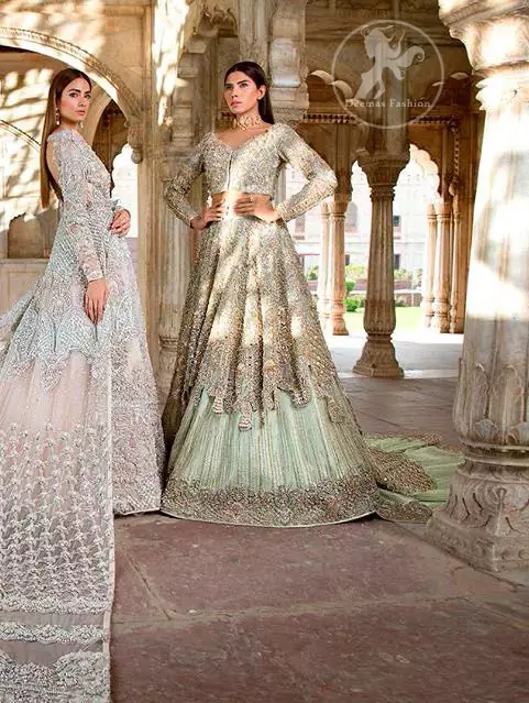 Reflecting exuberant color play in this ethereal piece meticulously highlighted with swarovski, pearl, silver kora and dabka. Heavily embellished in the front with intricate embroidered pattern and rich hemline. The sleeves are embellished with floral embroidery all over it. It comes with brocade pajama. This dress is paired with heavily embroidered organza dupatta that gives the right amount of glamour to the outfit. It is further furnished with four sided embellished border and geometric patterns.